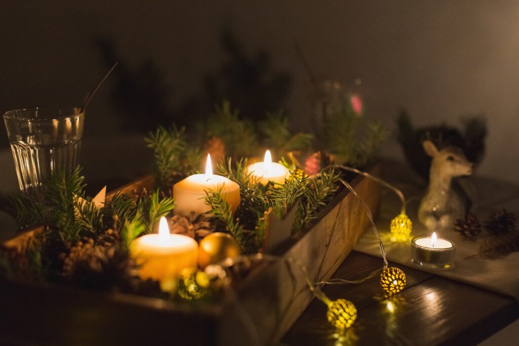candles and natural foliage for holiday table design ideas, natural and festive decorations for the holidays 