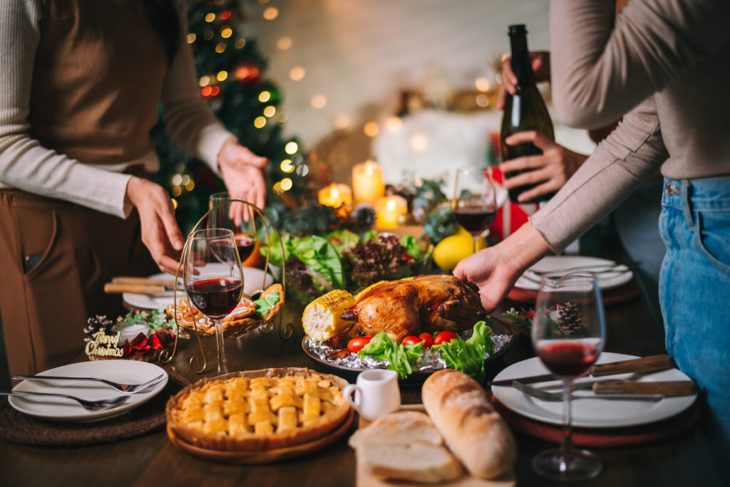 holiday table with food including wine and pie